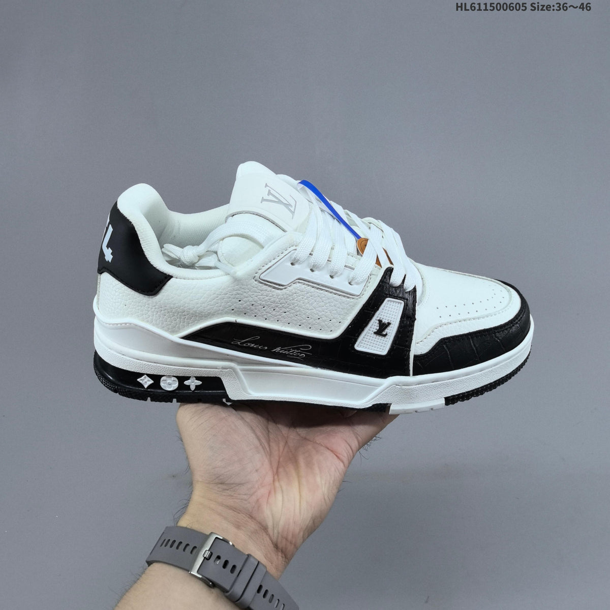 Louis Vuitton Low-Cut Sneakers in White with Floral or Black Trim - product image from the listing.
