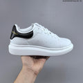 Alexander McQueen Oversized Low-Top Sneakers, in White and Black HL281000308 - product image from the listing.