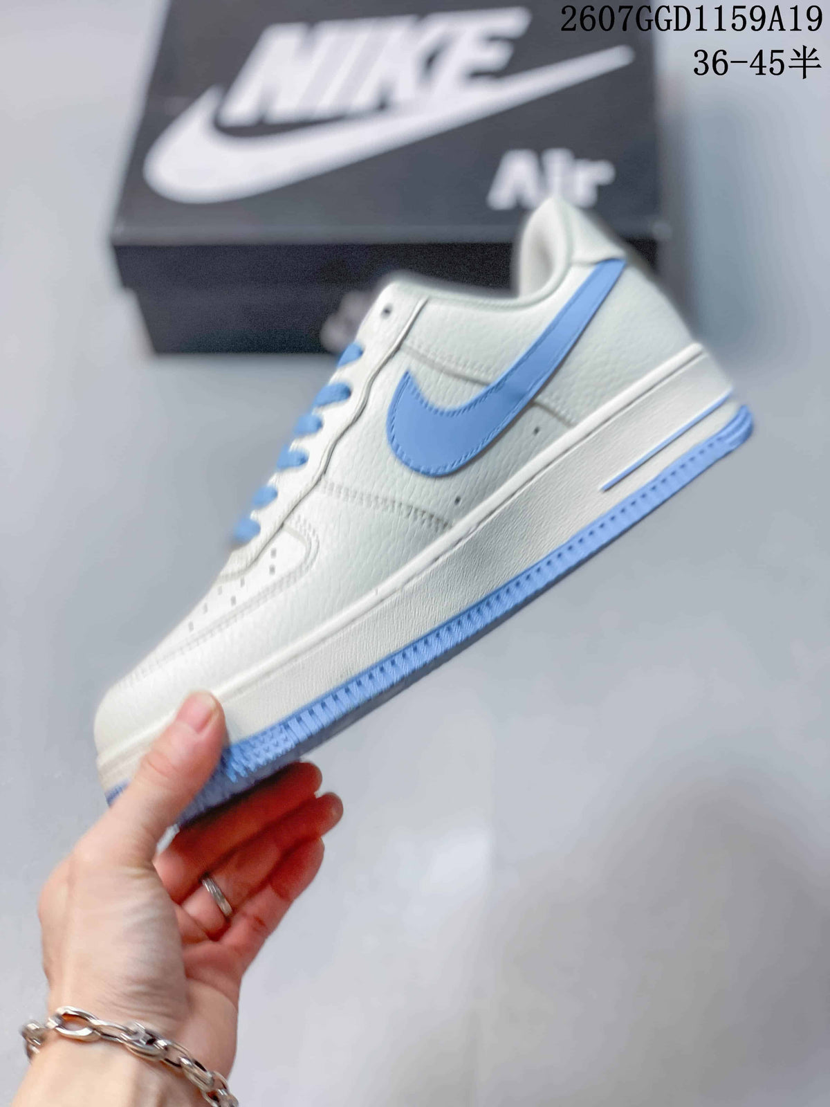 Nike Air Force 1 '07 Low Sneakers in White Light Blue - product image from the listing.