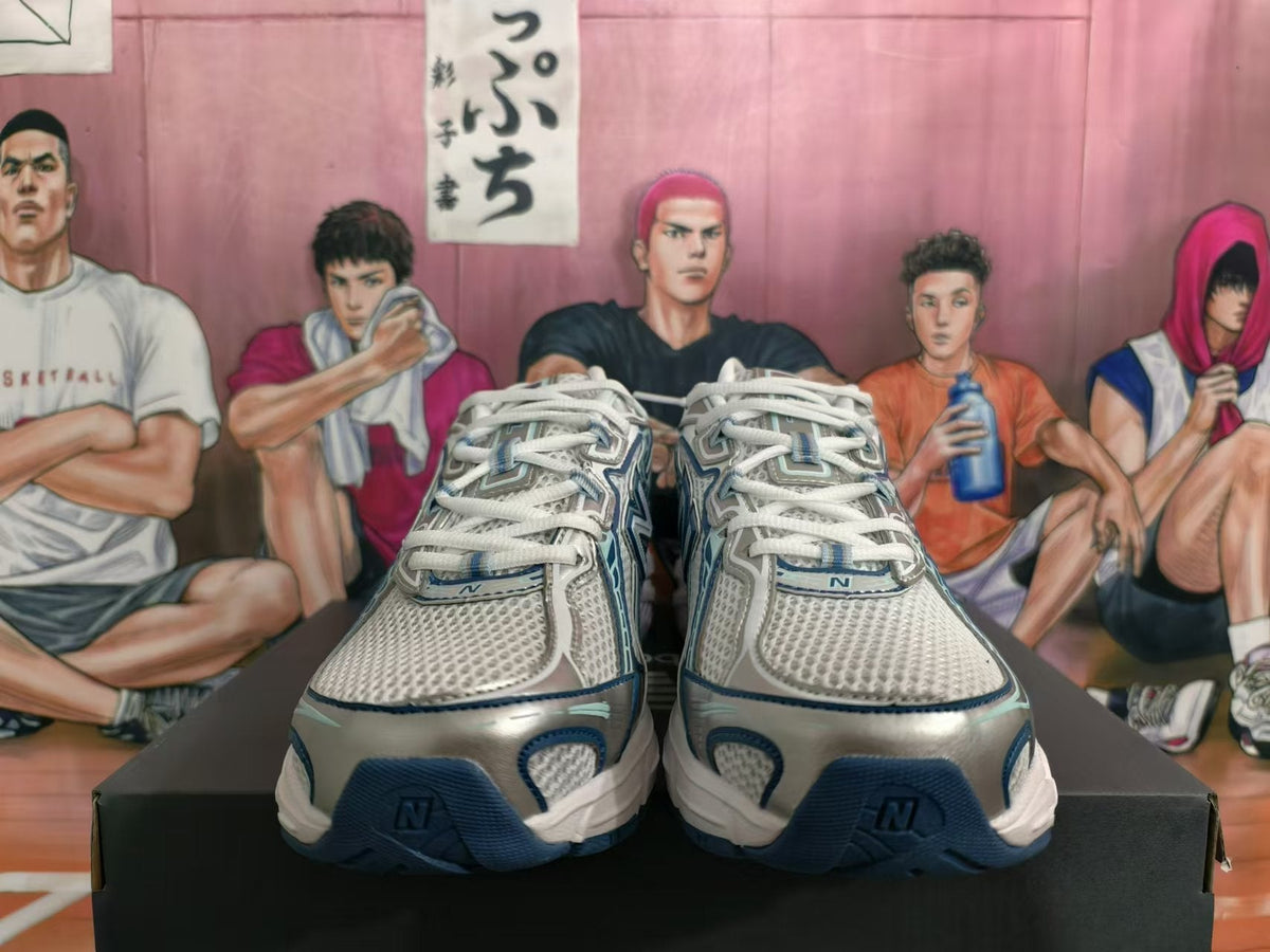 New Balance 740 Sneakers in White and Blue - product image from the listing.