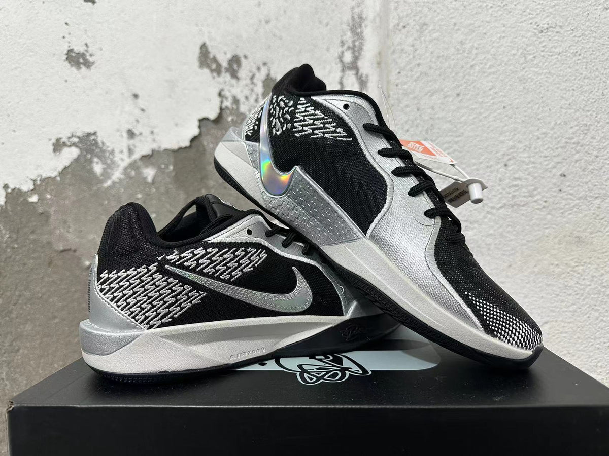 Nike Basketball Shoes in Black and Silver - product image from the listing.
