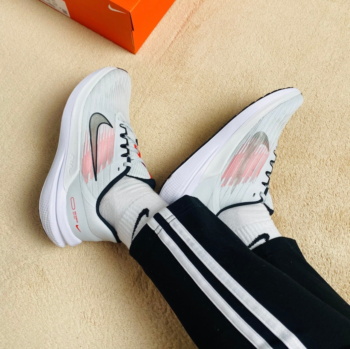 Nike Air Winflo 9 Running Shoes in White and Pink DD6203-009 - product image from the listing.
