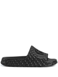 Interlocking G-appliqué textured slides by Gucci - product image from the listing.