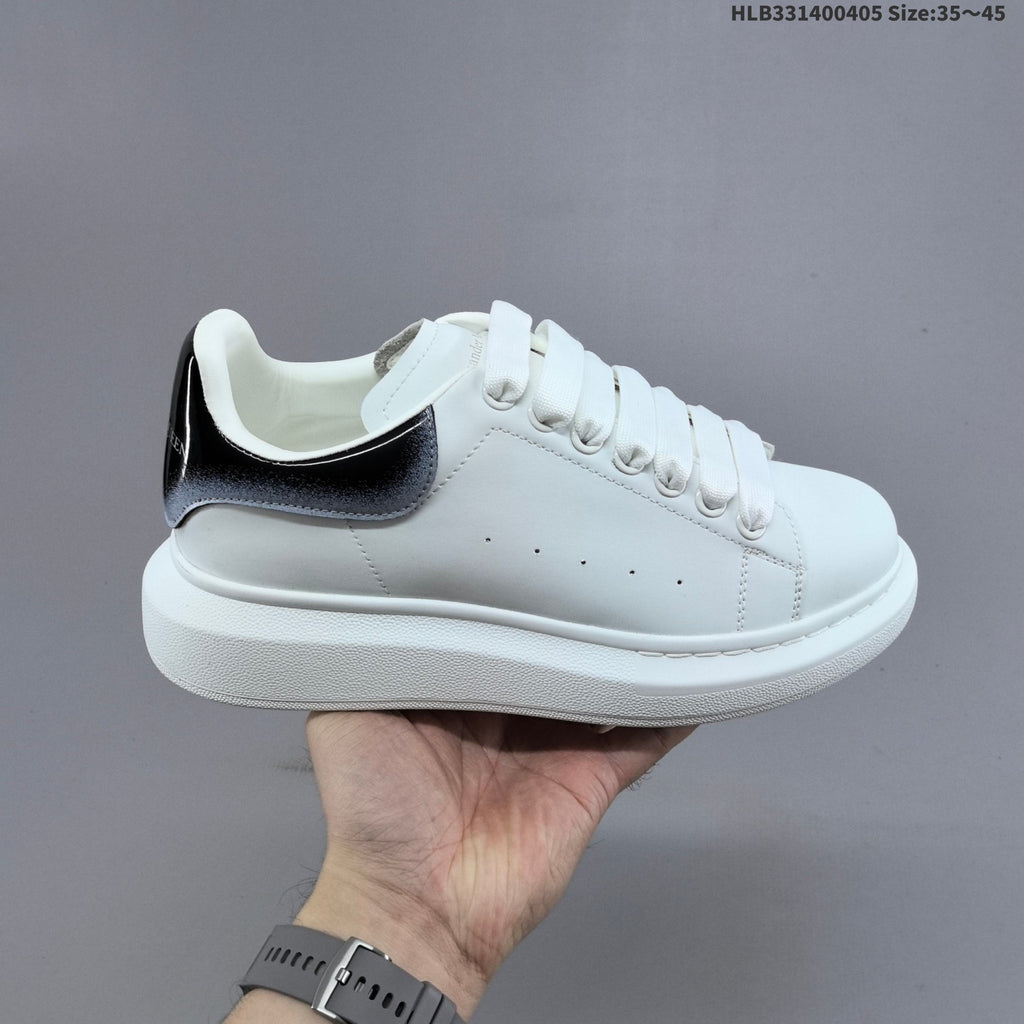 Alexander McQueen Oversized Low-Cut Sneakers, Black and Gold, HLB331400405 - product image from the listing.