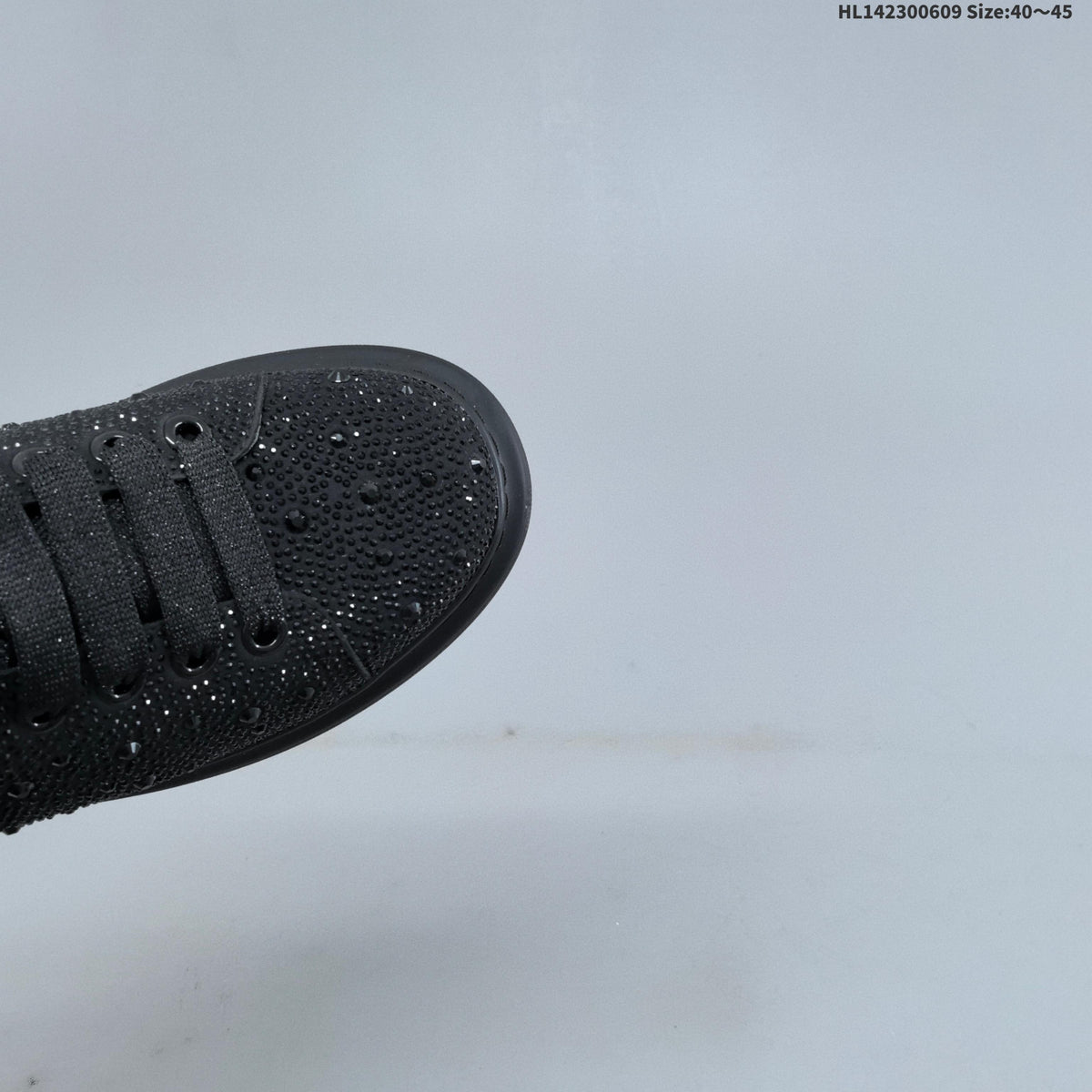 Alexander McQueen Black Crystal-Embellished Sneakers in Leather - product image from the listing.