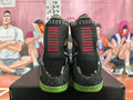 Nike Kobe 9 Elite High-Top Basketball Shoes, in Black and Green - product image from the listing.