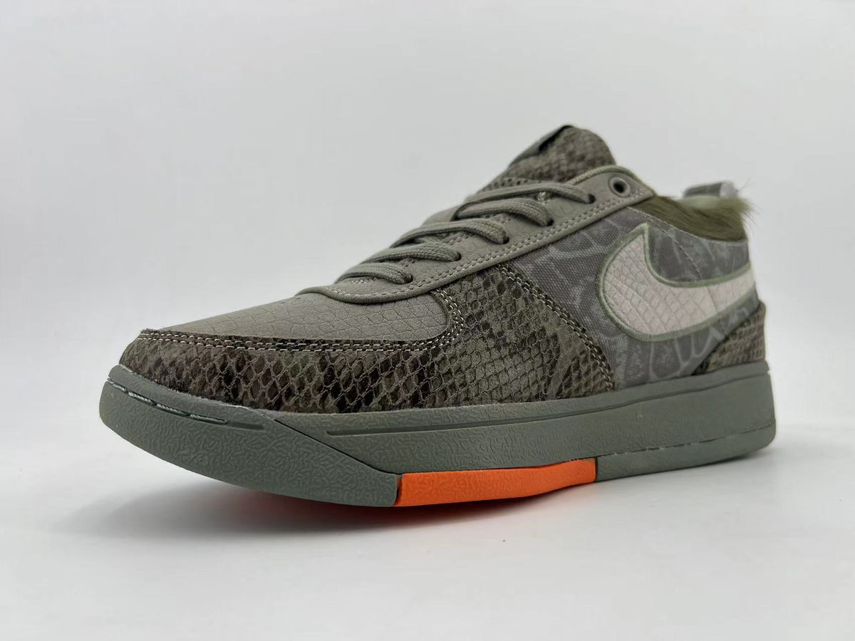 Gray and Orange Nike HF6236-002 Low-Top Sneakers - product image from the listing.