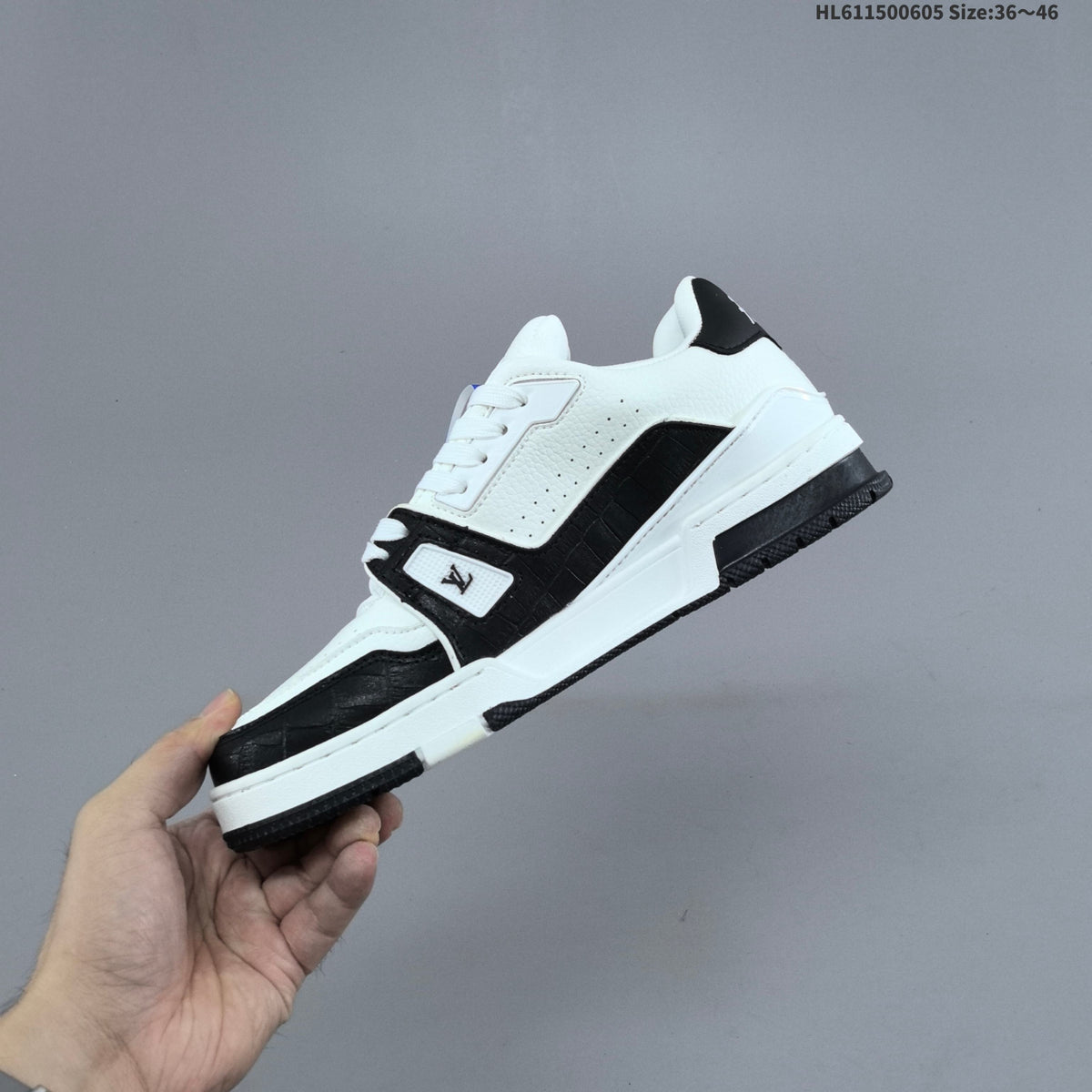 Louis Vuitton Low-Cut Sneakers in White with Floral or Black Trim - product image from the listing.