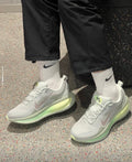 Nike Vomero 18 Running Shoes in Gray Green HM6803-002 - product image from the listing.