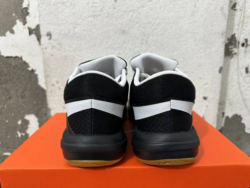 Nike Black and White Gum Sole Trainers - product image from the listing.