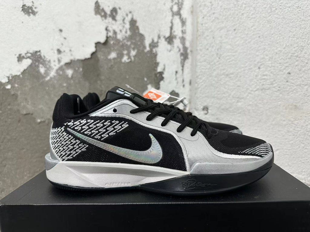 Nike Basketball Shoes in Black and Silver - product image from the listing.