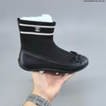 Chanel Sock Ballet Flats with Bow, in Black and White - product image from the listing.