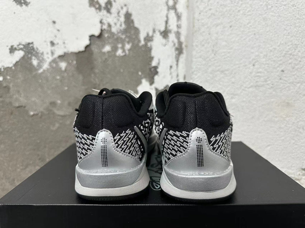 Nike Basketball Shoes in Black and Silver - product image from the listing.