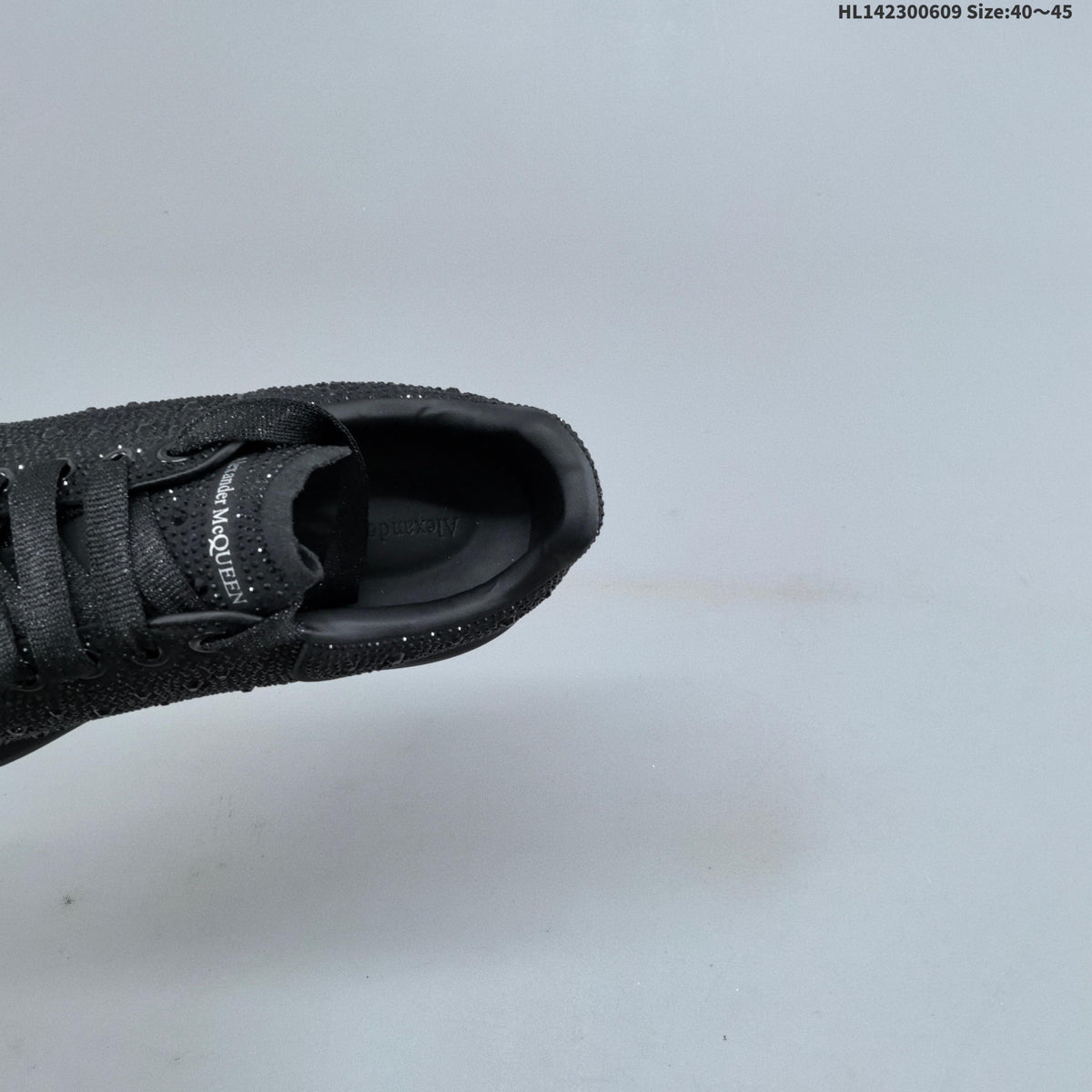 Alexander McQueen Black Crystal-Embellished Sneakers in Leather - product image from the listing.