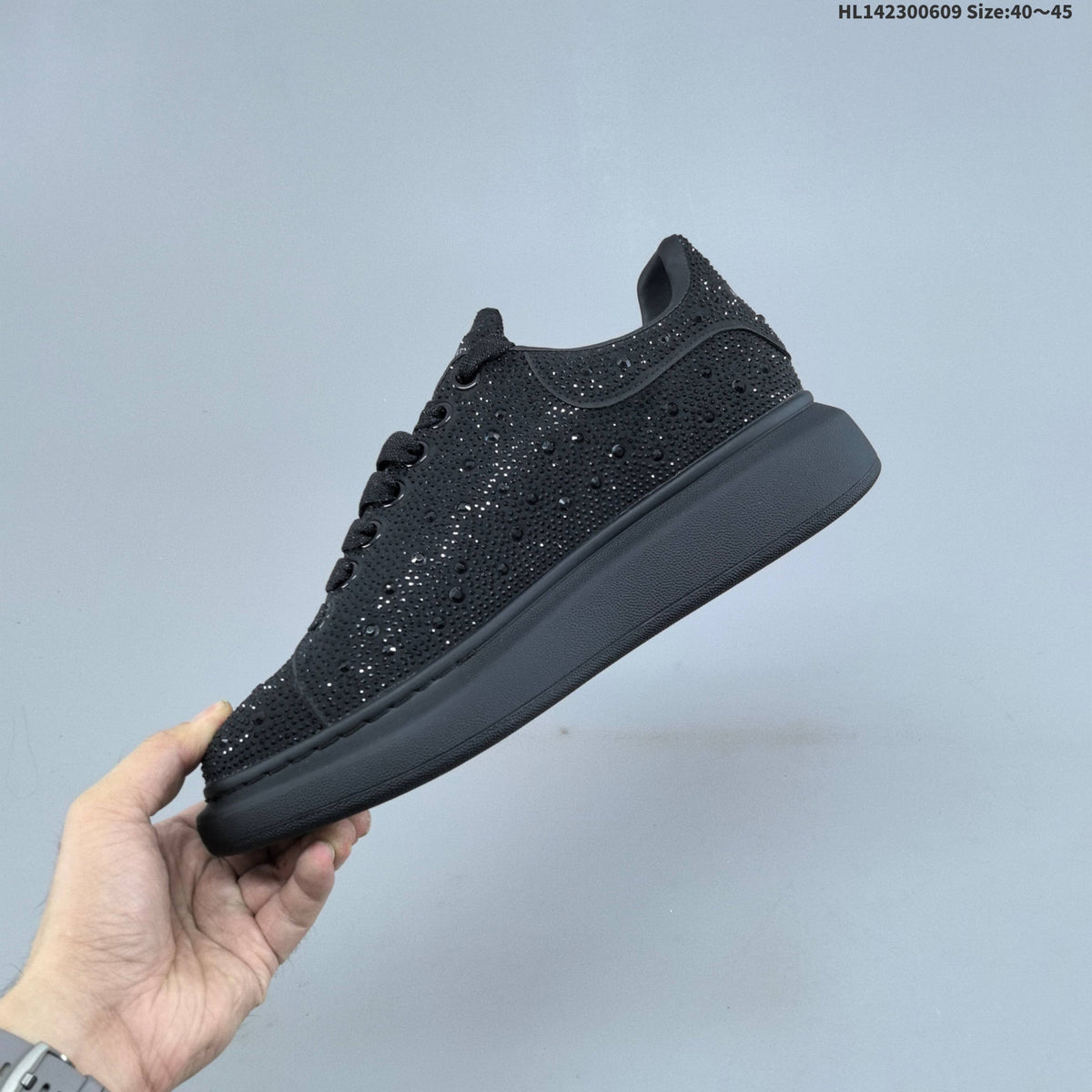 Alexander McQueen Black Crystal-Embellished Sneakers in Leather - product image from the listing.