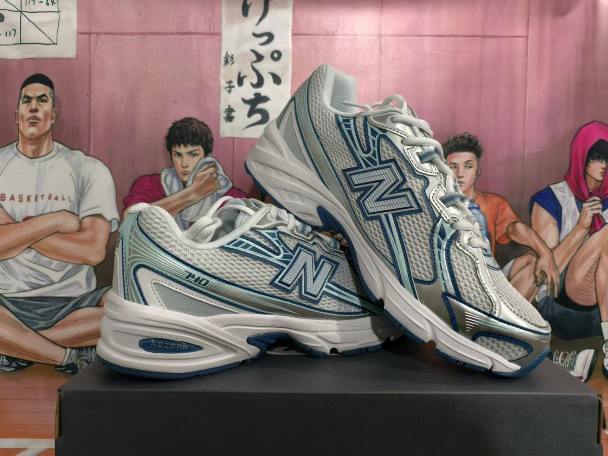 New Balance 740 Sneakers in White and Blue - product image from the listing.