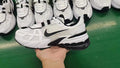 Nike White and Black Mesh Trainers 0736-101 - product image from the listing.