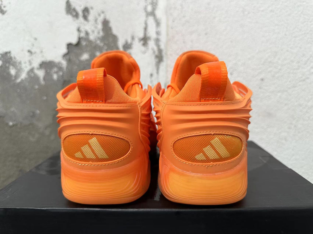 Orange Adidas Basketball Trainers - product image from the listing.