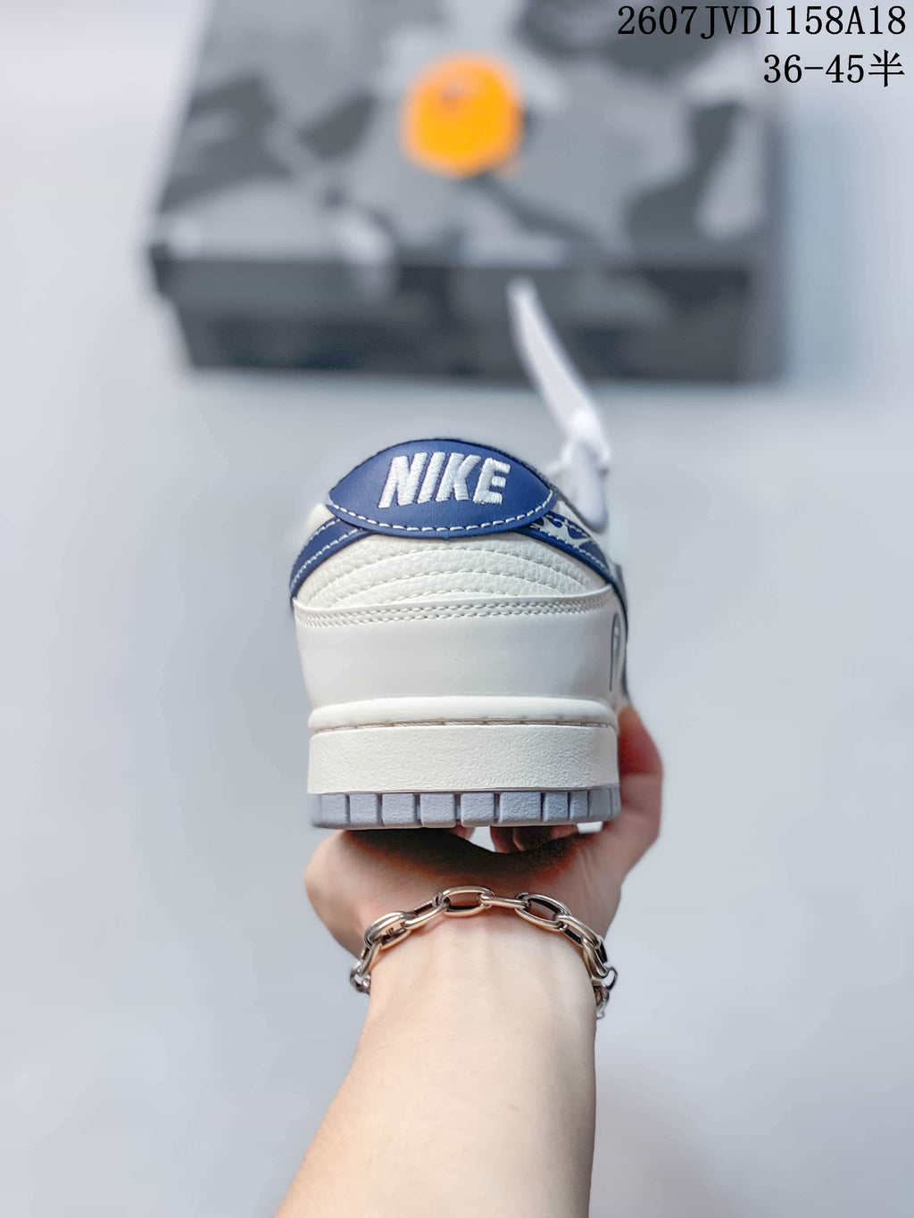 Nike SB Dunk Low Sneakers in Cream Gray Blue 2607JVD1158A18 - product image from the listing.