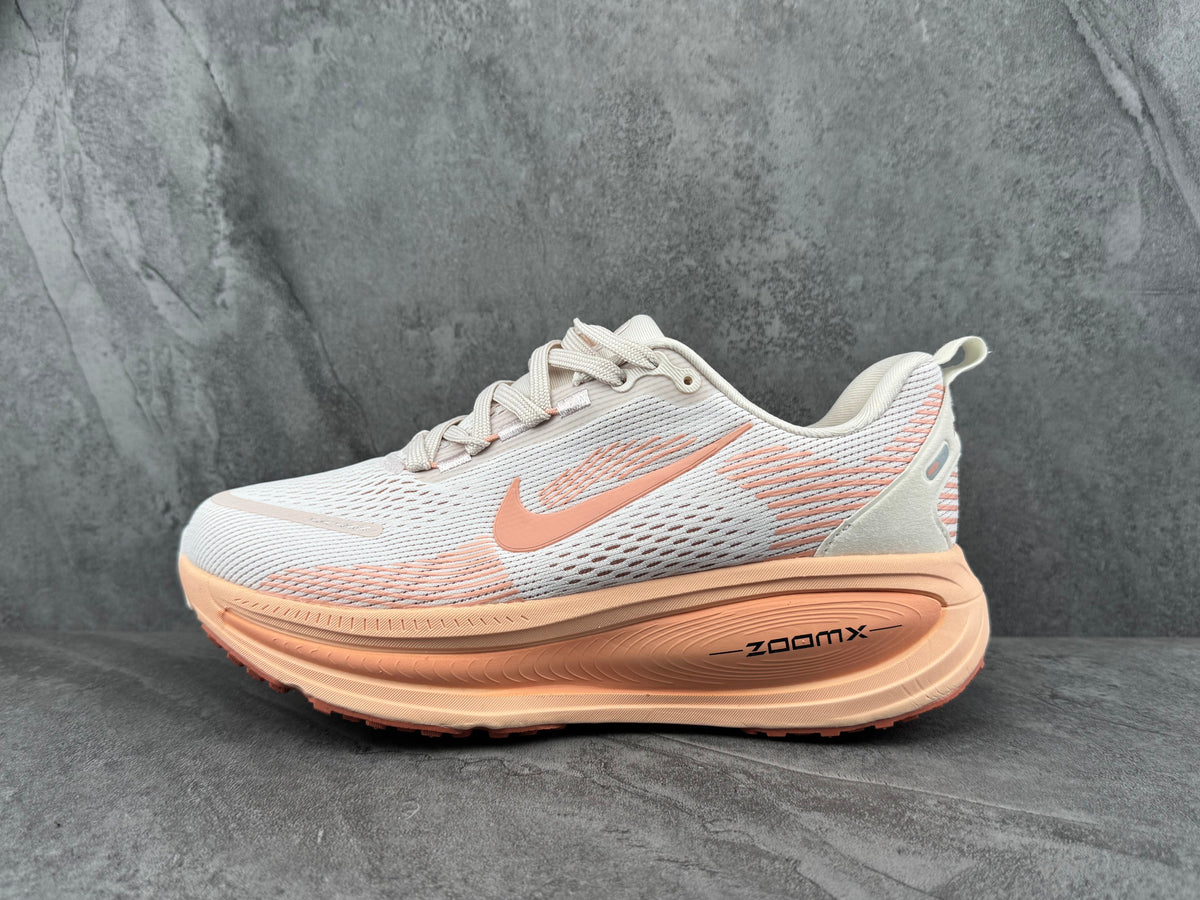 White and Peach Nike ZoomX Running Shoes - product image from the listing.