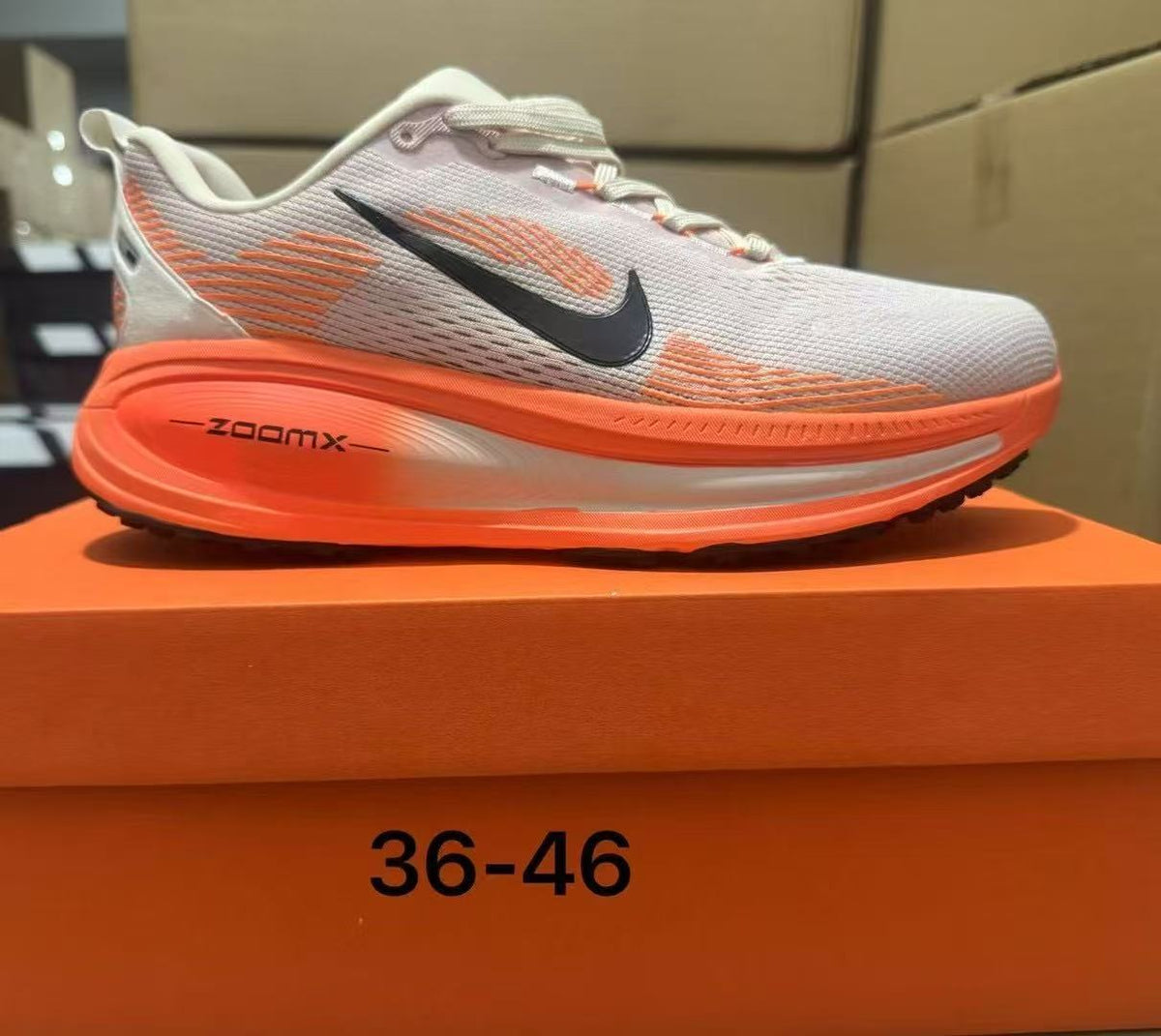 Beige and Orange Nike ZoomX Running Shoes - product image from the listing.