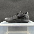 Nike All-Black Air Zoom Trainers - product image from the listing.