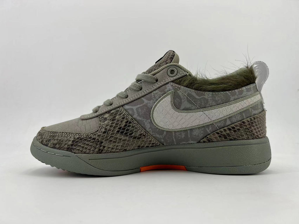 Gray and Orange Nike HF6236-002 Low-Top Sneakers - product image from the listing.
