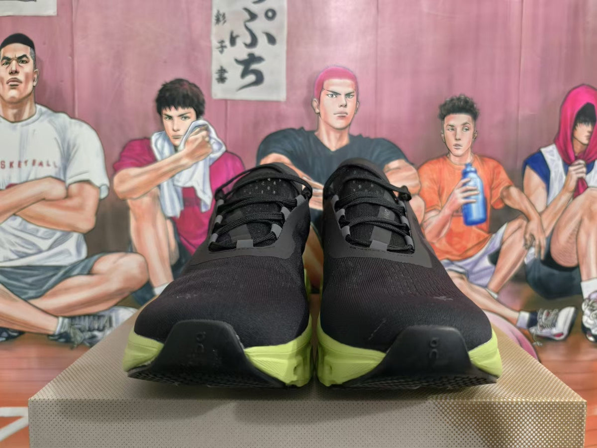 On Running Cloudmonster Sneakers in Black and Lime Green - product image from the listing.
