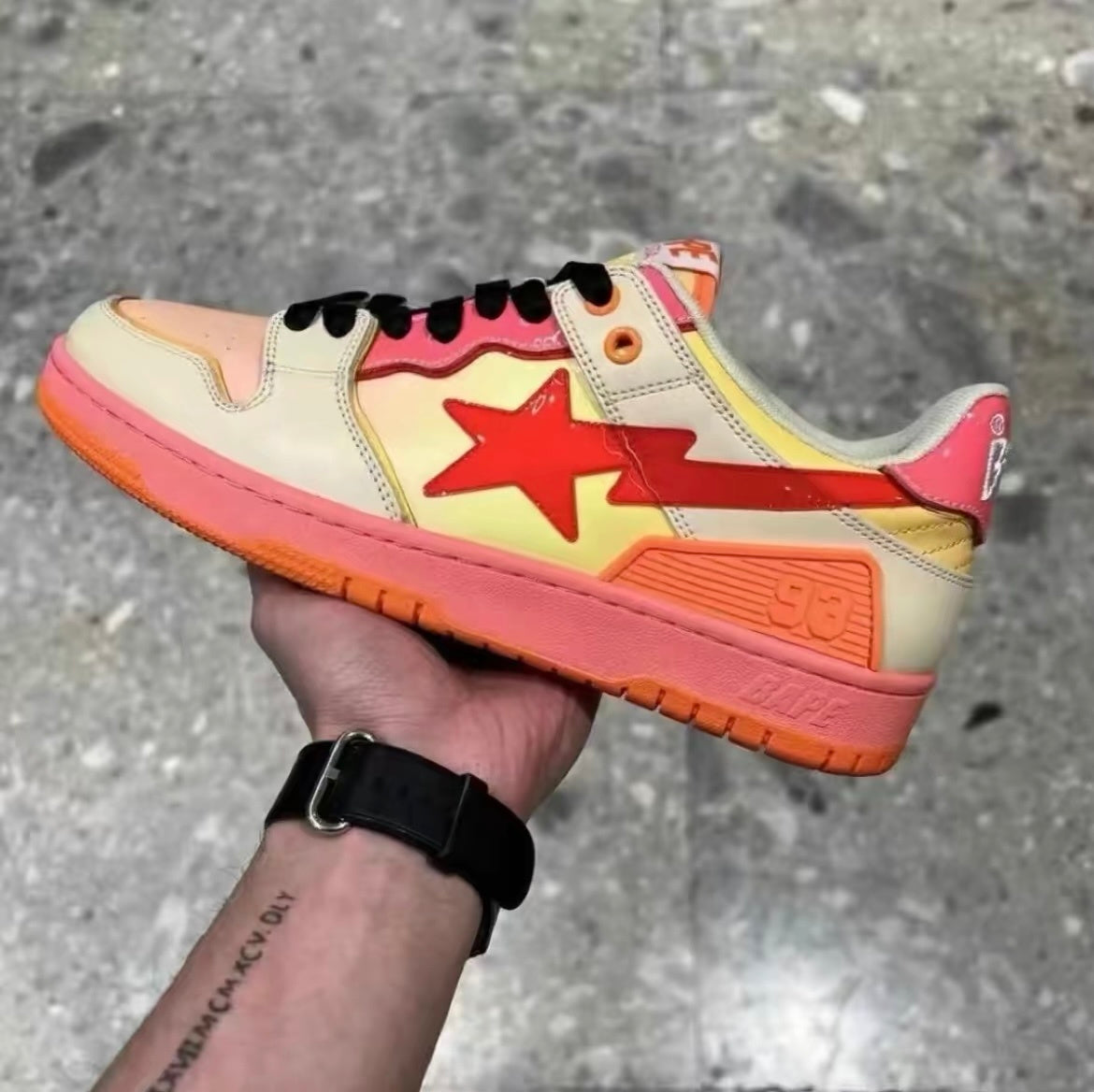 BAPE SK8 STA Low-Cut Sneakers in Orange Gradient - product image from the listing.