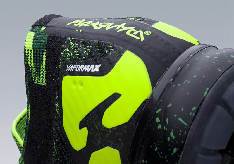 Nike Air VaporMax Moc 2 Acronym in Black Volt AQ0996-007 - product image from the listing.