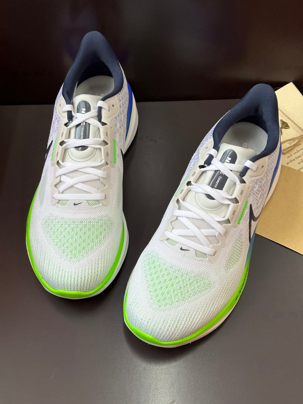 Nike Air Zoom Vomero 17 Running Shoes in White Green FB1309-100 - product image from the listing.