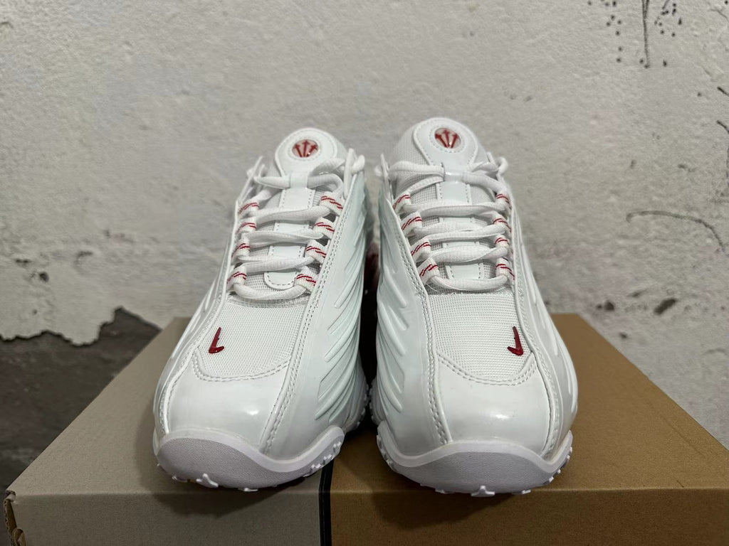 White and Red Athletic Trainers - product image from the listing.