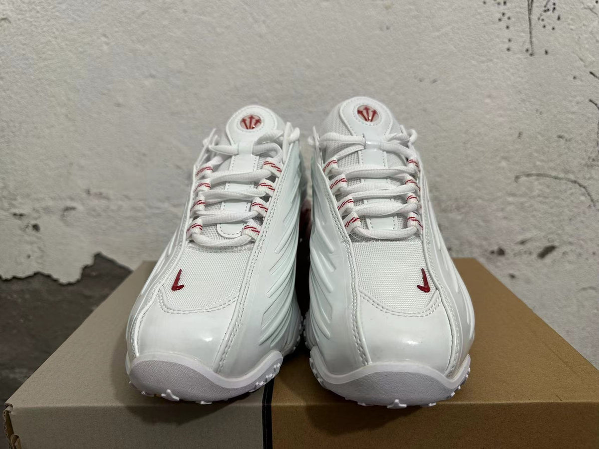 White and Red Athletic Trainers - product image from the listing.