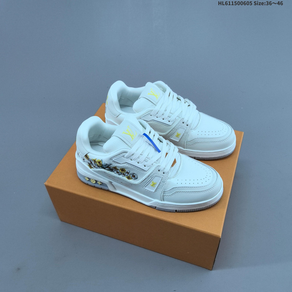 Louis Vuitton Low-Cut Sneakers in White with Floral or Black Trim - product image from the listing.
