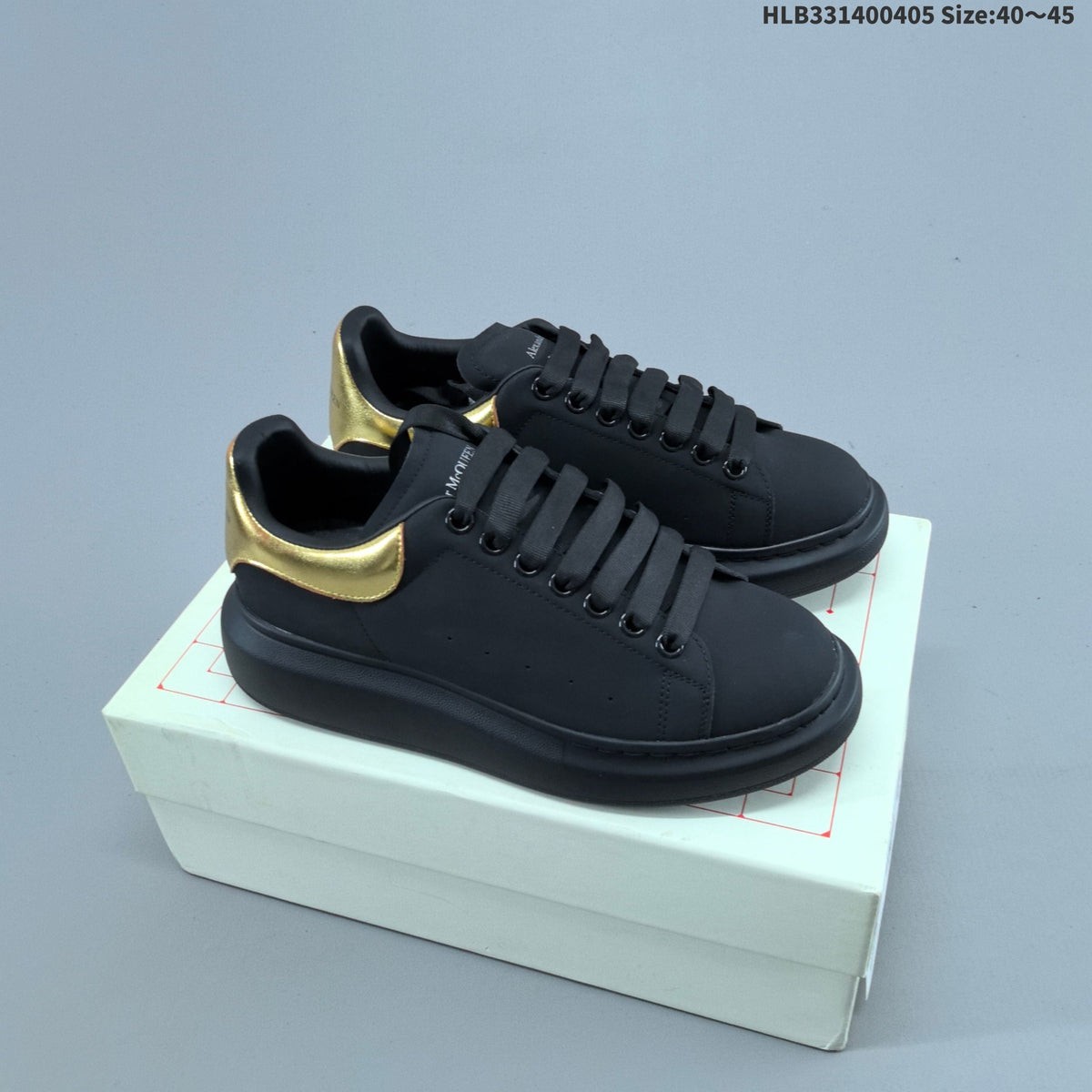 Alexander McQueen Oversized Low-Cut Sneakers, Black and Gold, HLB331400405 - product image from the listing.