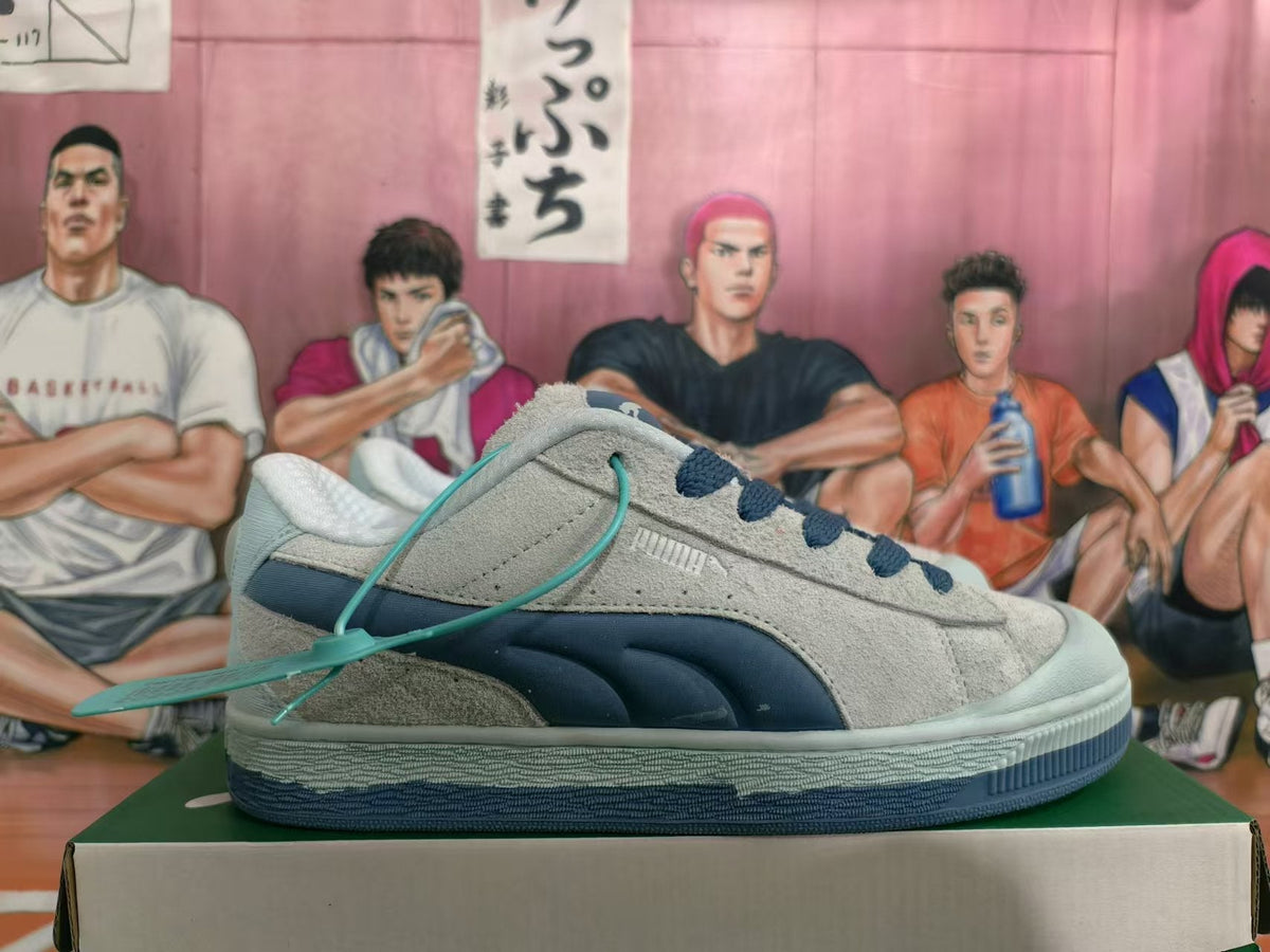 Blue and Gray Puma Suede Low-Top Sneakers - product image from the listing.