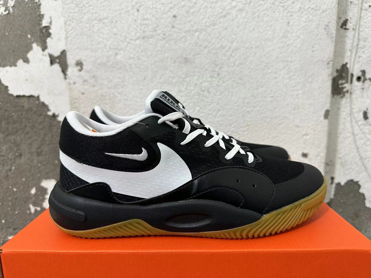 Nike Black and White Gum Sole Trainers - product image from the listing.