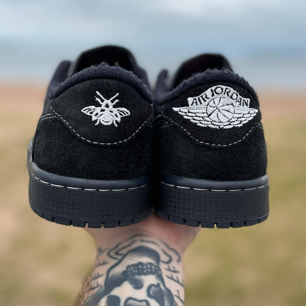 Jordan 1 Low OG Travis Scott Sneakers in Black DM7866-001 - product image from the listing.