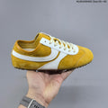 Women's GG Yellow and White Suede-Style Lace-Up Sneakers - product image from the listing.