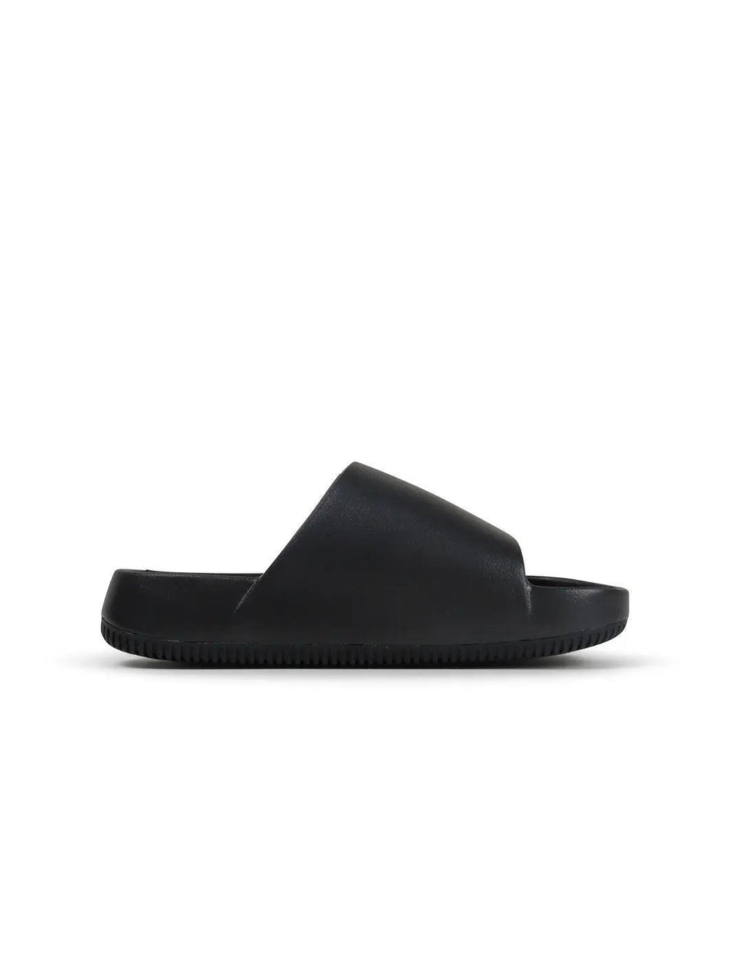 Women's Nike Calm Slide - Black - product image from the listing.