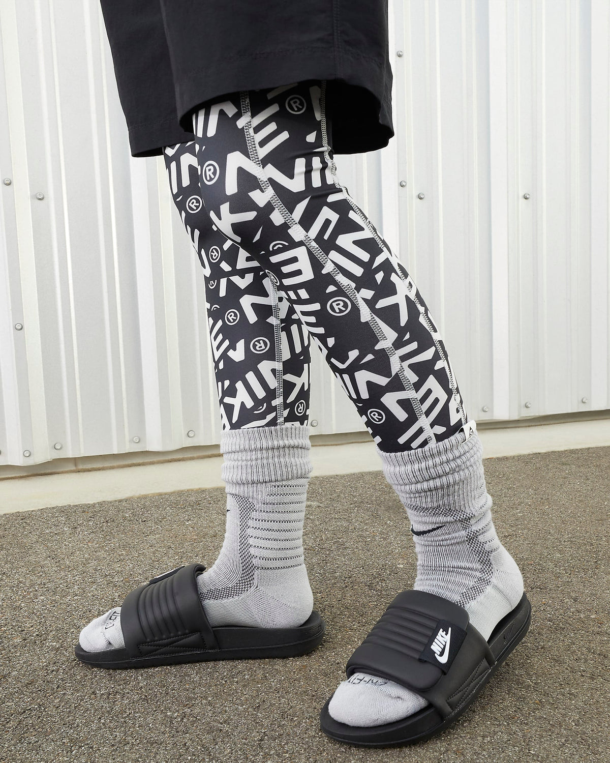 Women's Nike Offcourt Adjust Slides - Black / White - product image from the listing.