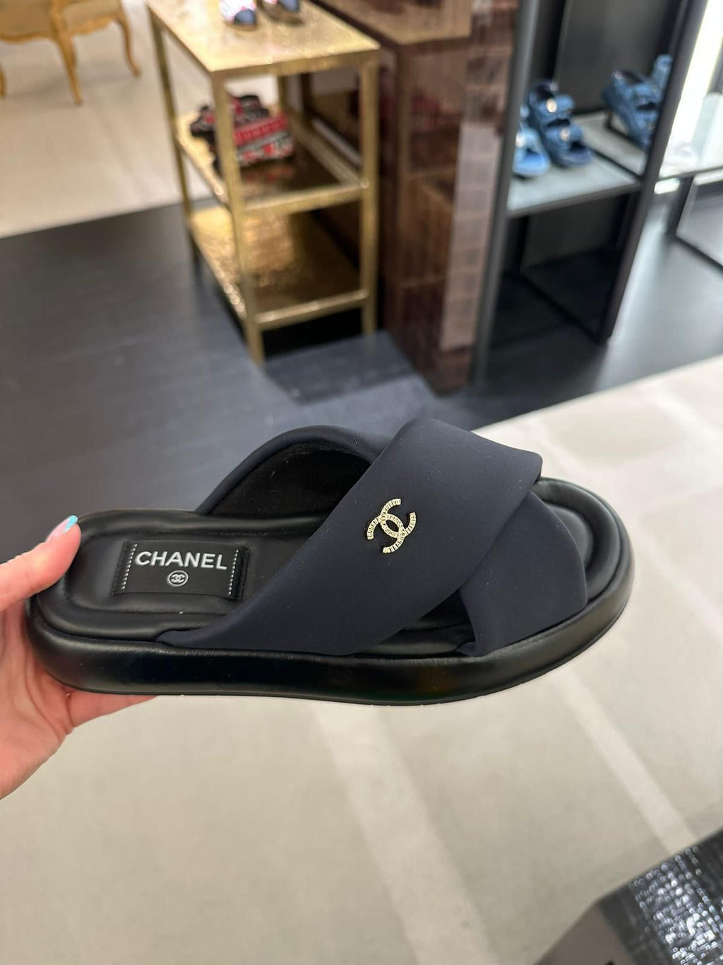 Chanel Crossover Mule Slides in Black - product image from the listing.