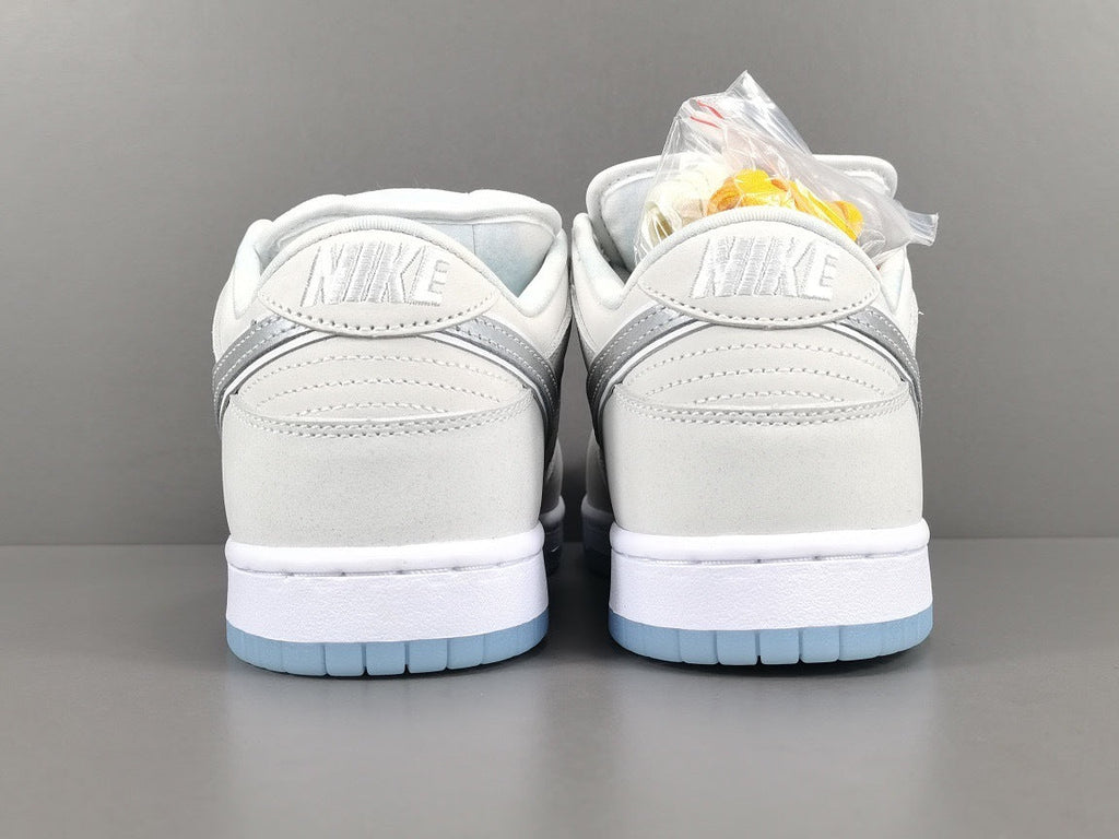 Nike Dunk Low SB Purple Lobster Sneakers in White FD8776-100 - product image from the listing.