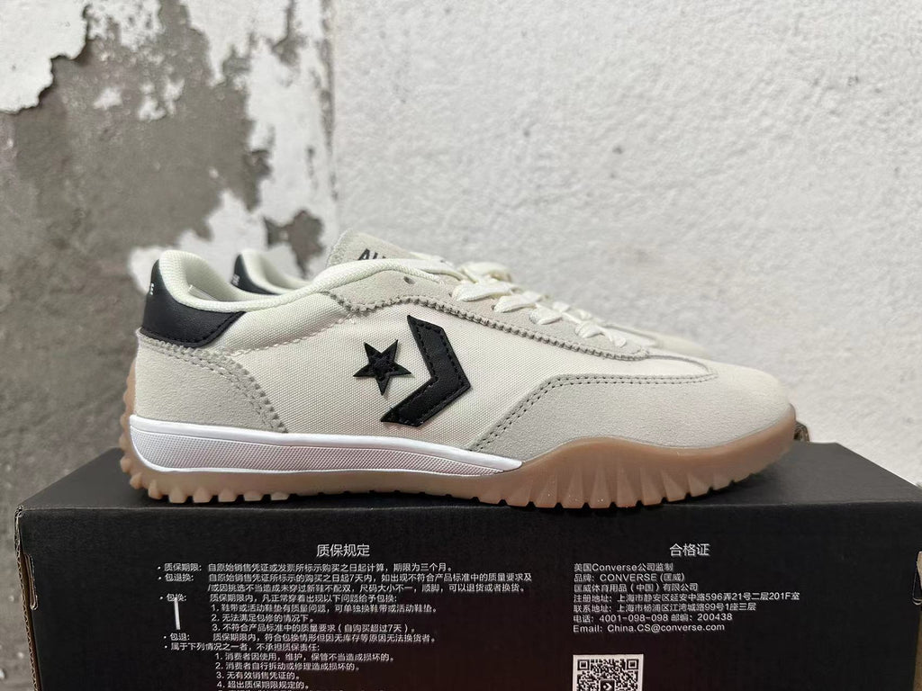 Cream and Black Converse Trainer-Style Sneakers - product image from the listing.