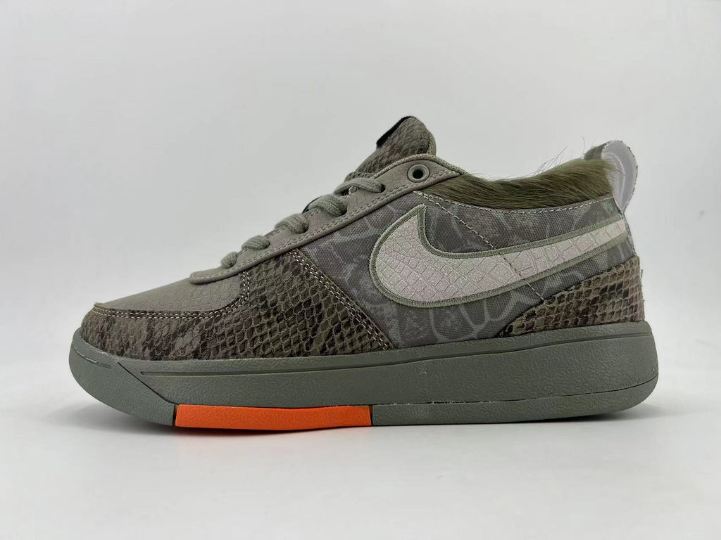 Gray and Orange Nike HF6236-002 Low-Top Sneakers - product image from the listing.