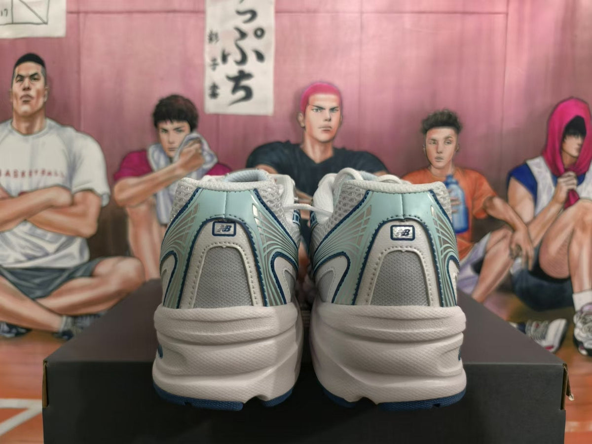 New Balance 740 Sneakers in White and Blue - product image from the listing.