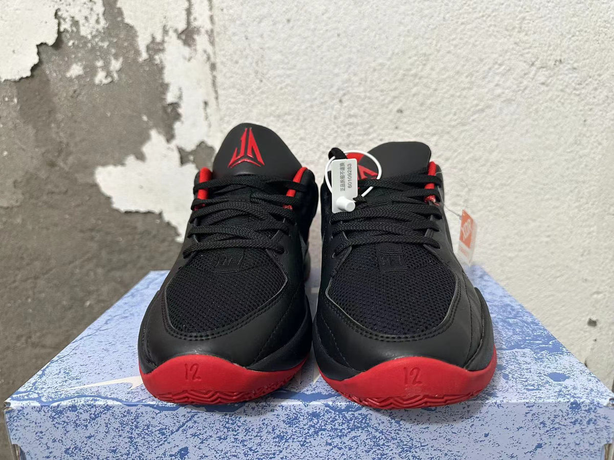 Nike Zoom Air Basketball Shoes in Black and Red - product image from the listing.