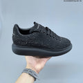 Alexander McQueen Black Crystal-Embellished Sneakers in Leather - product image from the listing.