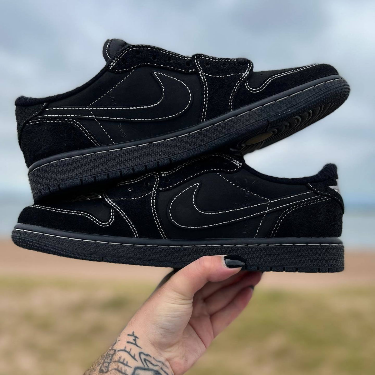 Jordan 1 Low OG Travis Scott Sneakers in Black DM7866-001 - product image from the listing.