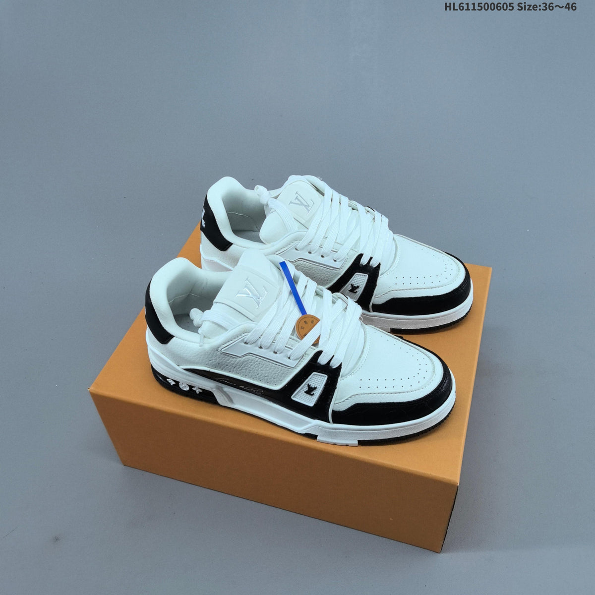 Louis Vuitton Low-Cut Sneakers in White with Floral or Black Trim - product image from the listing.